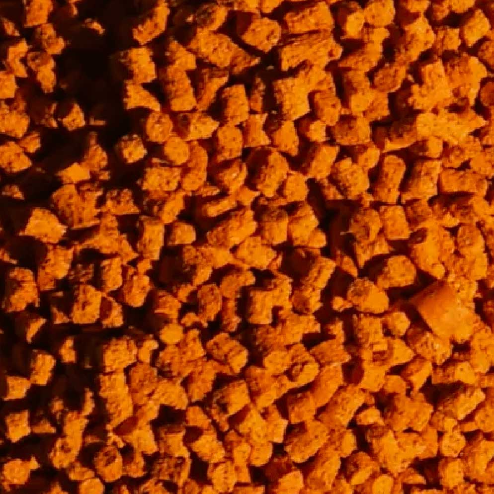 Close-up of orange sustainable granules